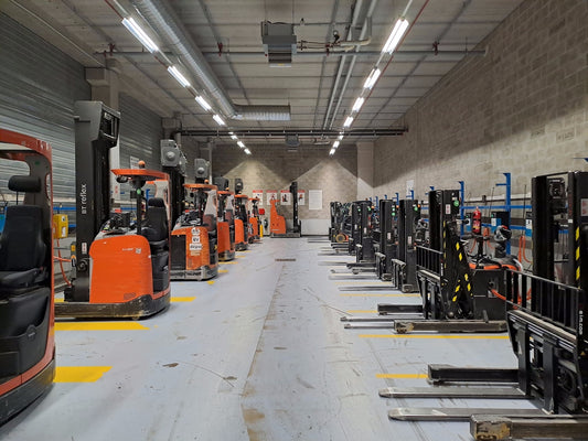 A large warehouse filled with lots of machines